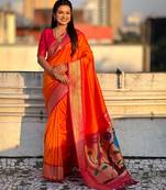 Orange color paithani silk fabric woven designer saree