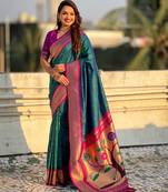 Teal color paithani silk fabric woven designer saree