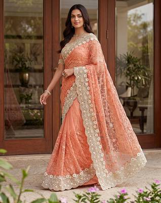 Blue color net fabric wedding wear heavy embroidery work with pearls diamonds work saree 1