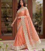 Blue color net fabric wedding wear heavy embroidery work with pearls diamonds work saree