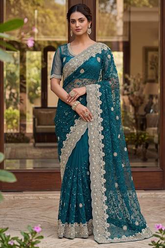 Blue color net fabric wedding wear heavy embroidery work with pearls diamonds work saree