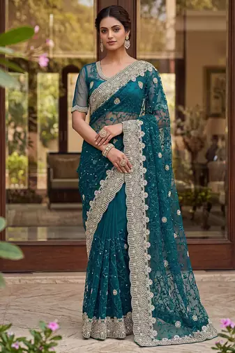 Blue color net fabric wedding wear heavy embroidery work with pearls diamonds work saree