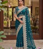 Blue color net fabric wedding wear heavy embroidery work with pearls diamonds work saree