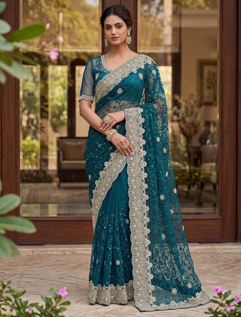 Blue color net fabric wedding wear heavy embroidery work with pearls diamonds work saree