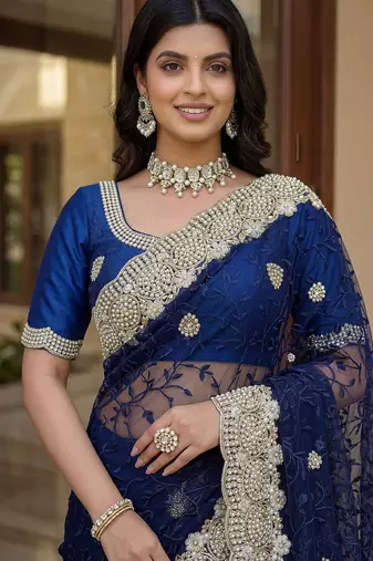 Blue color net fabric wedding wear heavy embroidery work with pearls diamonds work saree