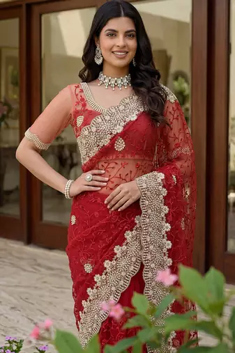 Blue color net fabric wedding wear heavy embroidery work with pearls diamonds work saree
