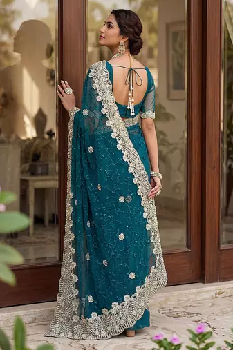 Blue color net fabric wedding wear heavy embroidery work with pearls diamonds work saree