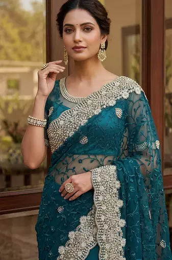 Blue color net fabric wedding wear heavy embroidery work with pearls diamonds work saree