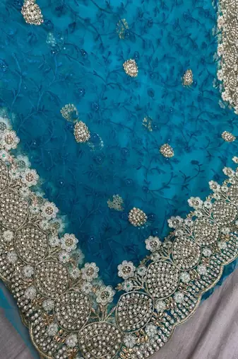 Blue color net fabric wedding wear heavy embroidery work with pearls diamonds work saree