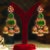 Gold plated green stones jhumkas