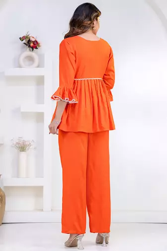 orange rayon stitched kurti set with lace design