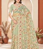 Dusty pista color net resham embroidered & zircon work saree