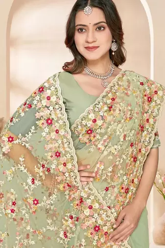 Dusty pista color net resham embroidered & zircon work saree