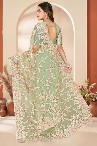 Dusty pista color net resham embroidered & zircon work saree