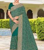 Rama color georgette zari embroidered & zircon work saree