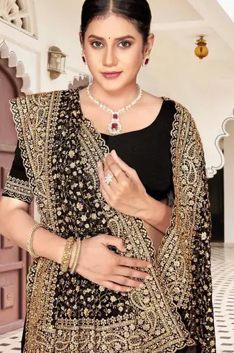 Black color georgette zari embroidered & zircon work saree