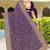 Purple color georgette zari embroidered & zircon work saree