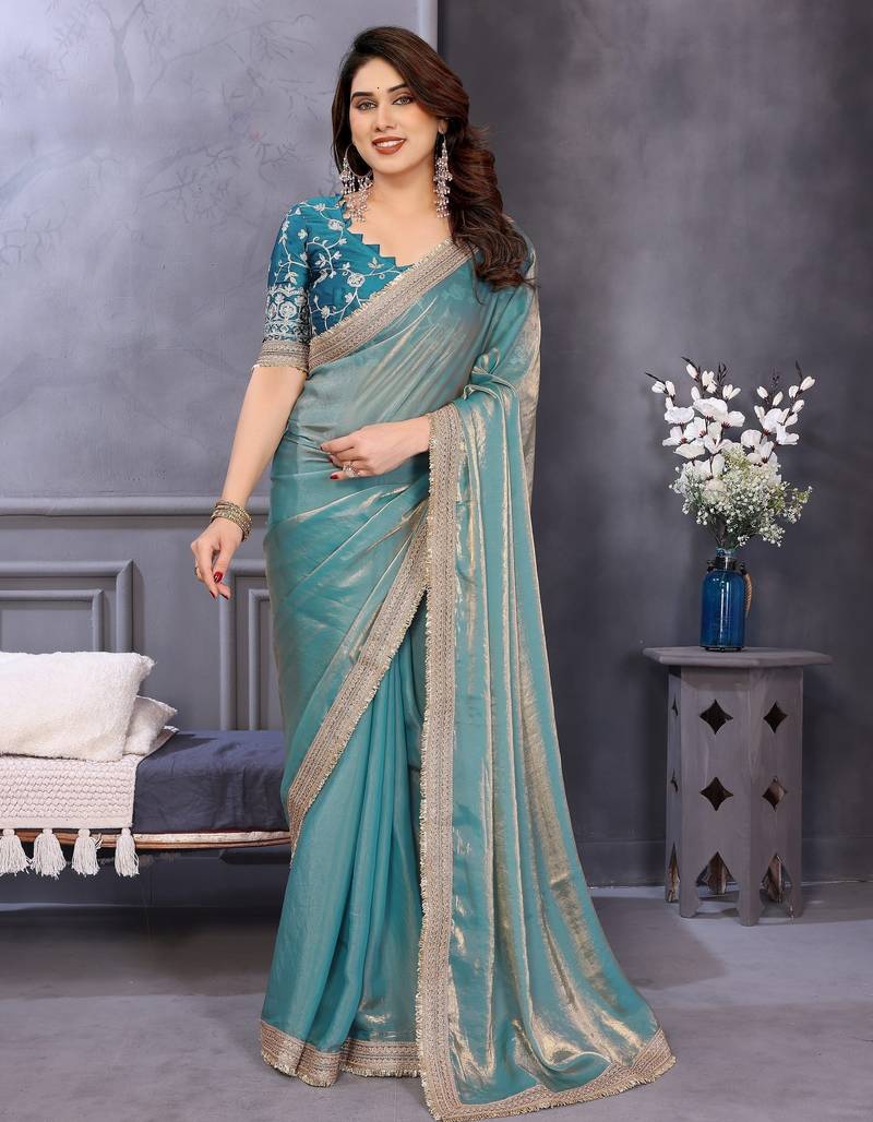 Sky blue fandy satin saree with embroidered lace border and matching blouse piece