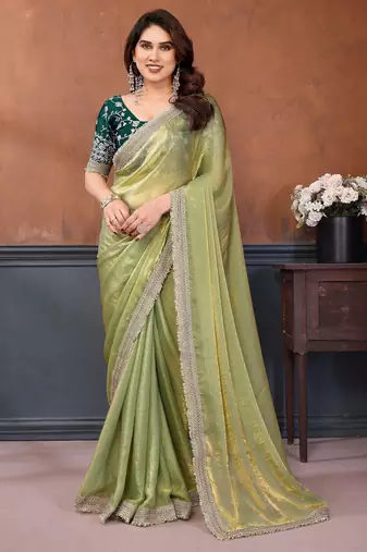 Light green fandy satin saree with embroidered lace border and matching blouse piece
