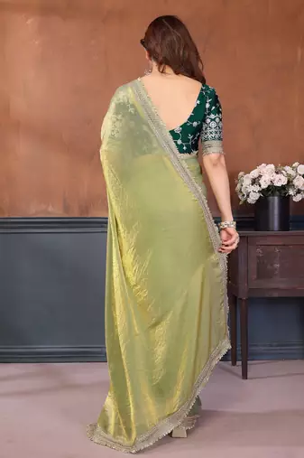 light green party wear satin saree with lace border