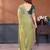 Light green fandy satin saree with embroidered lace border and matching blouse piece