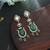 Green color american diamond earrings