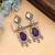 Purple color american diamond earrings