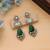 Green color american diamond earrings
