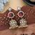 Red color american diamond earrings