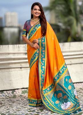 orange soft art silk saree with teal dual zari border 1