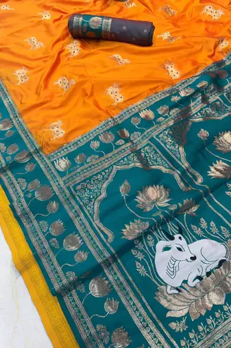 orange soft art silk saree with teal dual zari border