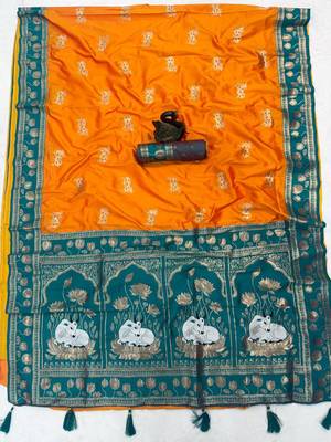 orange soft art silk saree with teal dual zari border 4