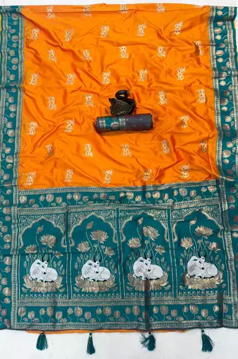 orange soft art silk saree with teal dual zari border