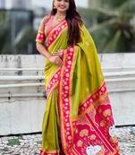 parrot green soft art silk saree with pink zari border