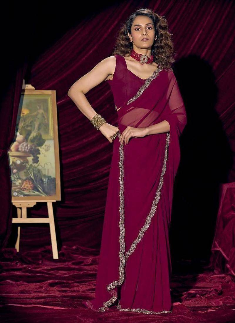 Wine color pure georgette zircon handwork border saree
