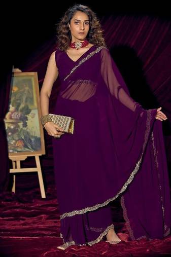 Purple color pure georgette zircon handwork border saree