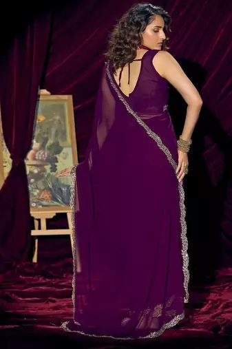 Purple color pure georgette zircon handwork border saree