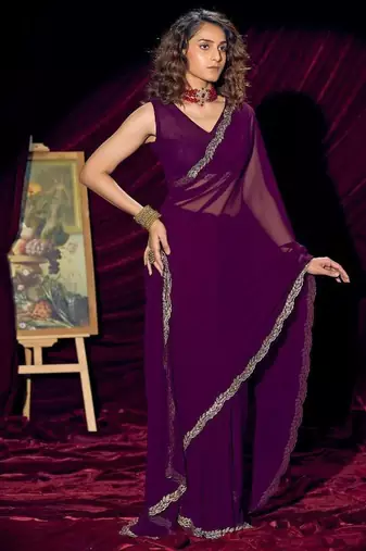Purple color pure georgette zircon handwork border saree