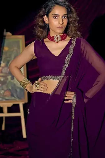 Purple color pure georgette zircon handwork border saree