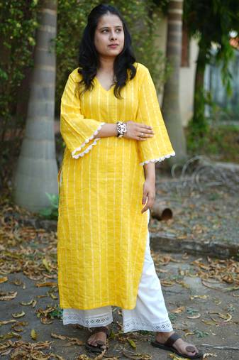 yellow cotton kurti pant set with kantha work design
