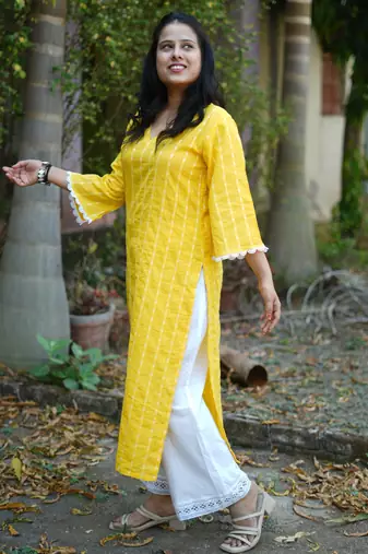 yellow cotton kurti pant set with kantha work design