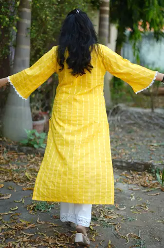 yellow cotton kurti pant set with kantha work design