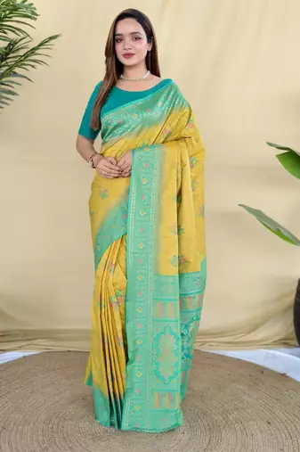 Yellow silk saree featuring elegant traditional motifs all over the saree with contrast blouse