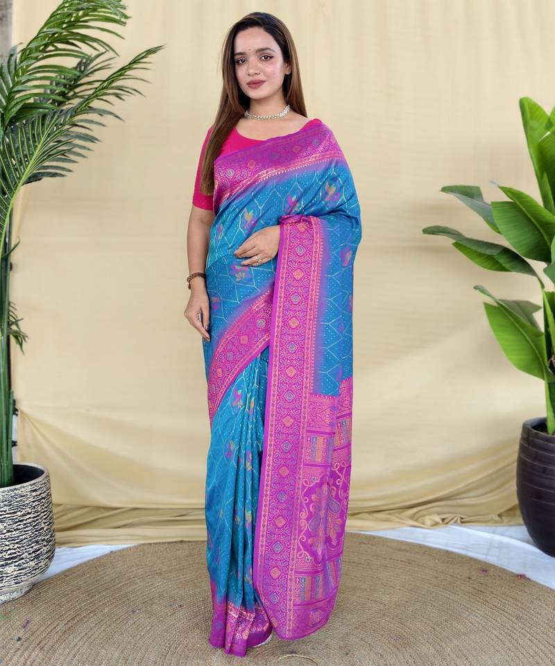 Sky silk saree featuring elegant traditional motifs all over the saree with contrast blouse