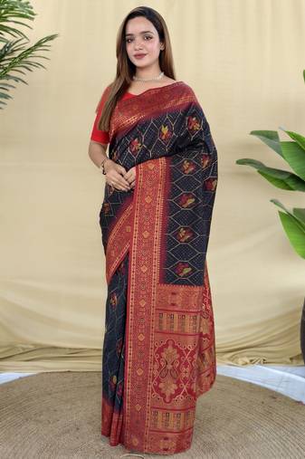 Black silk saree featuring elegant traditional motifs all over the saree with contrast blouse