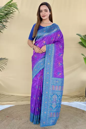 Purple silk saree featuring elegant traditional motifs all over the saree with contrast blouse