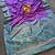 Purple silk saree featuring elegant traditional motifs all over the saree with contrast blouse
