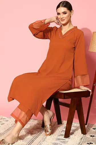 Rust flared sleeve organza detailed v neck textured kurta with palazzo