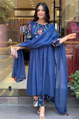 Beautiful jaipuri a blue colored cotton anarkali kurta set with printed trousers and a solid blue dupatta.