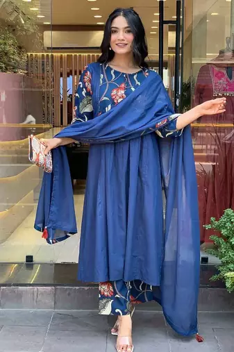 Beautiful jaipuri a blue colored cotton anarkali kurta set with printed trousers and a solid blue dupatta.